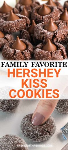 a hand touching a chocolate covered hershey kiss cookies on a white plate with more cookies in the background