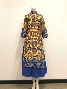 A Beautiful Silk Ao Dai Dress. The colors and print of the fabric are just gorgeous! Fully lined. Zips up the back. A beautiful statement piece. Condition: Excellent-pre-owned. Please see pictures. Lay flat measurements: Shoulder to shoulder: 13.5 inches. Armpit to armpit: 17 inches. Waist: 15 inches. Hips: 18 inches. Length: 5 inches. Arm inseam: 12 inches. Mahalo, Christina Multicolor Silk A-line Maxi Dress, Yellow Silk Dresses With Printed Motifs, Yellow Silk Dress With Printed Motifs, Fitted Multicolor Digital Print Dress, Multicolor Digital Print Maxi Dress, Multicolor Silk Dresses With Vibrant Print, Vibrant Multicolor Abstract Print Dress, Silk Fitted Dress With Printed Motifs, Fitted Silk Dress With Printed Motifs