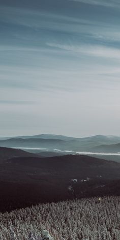 a person on skis is looking out over the mountains