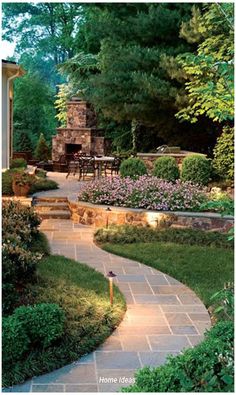 an outdoor patio with stone steps and landscaping