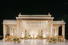 an elaborately decorated stage set up for a wedding