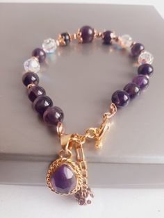 New Amethyst Semiprecious Stone, Faceted Crystal  and Gold 14K  Bracelet from Peru. 8 1/2  inches length. Spiritual Amethyst Gold Bracelets, Gold Amethyst Bracelets For Healing, Elegant Gold Amethyst Crystal Bracelet, Gold Amethyst Gemstone Bracelets, Elegant Rosary Bracelet For Healing, Elegant Gemstone Beads Charm Bracelet For Healing, Round Amethyst Bracelets With Gemstone Accents, Elegant Amethyst Crystal Bracelet With Natural Stones, Spiritual Amethyst Bracelets With Gemstone Accents