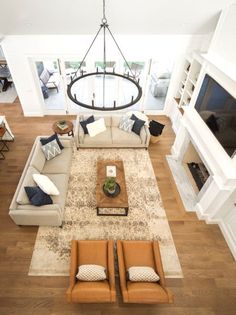 an overhead view of a living room with couches and chairs