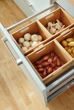 an open drawer filled with different types of vegetables