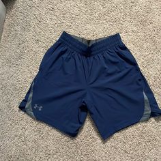 Never Worn Blue Athletic Shorts With Pockets, Blue Athleisure Shorts With Pockets, Under Armour Blue Bottoms For Summer, Sporty Under Armour Shorts With Pockets, Under Armour Summer Shorts With Pockets, Under Armour Blue Shorts For Summer, Under Armour Short Bottoms With Pockets, Sporty Blue Athletic Shorts By Under Armour, Under Armour Shorts With Pockets