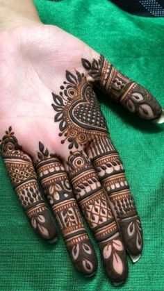 henna tattoo on the palm of someone's hand