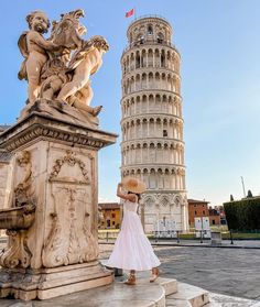 a woman standing in front of the leaning tower