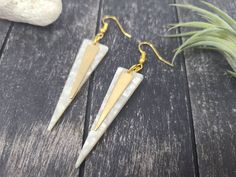 "These marbled white and gold dangle earrings feature 1/4\" wide by 1-3/8\" flat raw brass triangle/spike charms layered over 49mm x 13.5mm acrylic acetate inverted triangle charms. These earrings measure approximately 2 7/8 inches from the top of the teardrop to the bottom of the white charm, and are incredibly lightweight, weighing just 0.1 ounce combined! These earrings are available in other colors as well! The green version of these earrings is available here: https://www.etsy.com/listing/7 White Brass Drop Earrings, White Brass Pierced Earrings, White Metal Dangle Plug Earrings, White Brass Earrings For Pierced Ears, White Metal Plug Earrings With Ear Wire, White Metal Drop Plug Earrings, White Brass Earrings With Ear Wire, White Brass Dangle Earrings, Nickel-free White Linear Drop Earrings