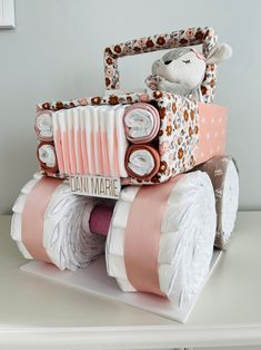 a cake made to look like an old car with wheels and a teddy bear sitting on top