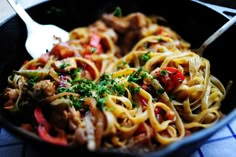 pasta with meat, tomatoes and parsley in a skillet