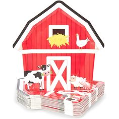 a red barn with farm animals on it and stacks of plates in the foreground