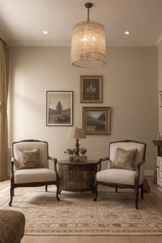 a living room with two chairs and a table