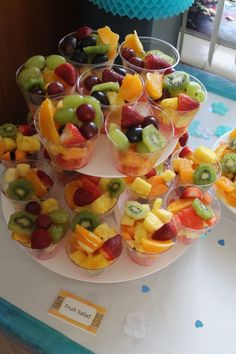 several cups filled with fruit on top of a table