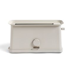 a white toaster sitting on top of a counter