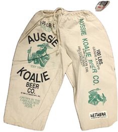 Deadstock Vintage Aussie Koalie Beer Co. Graohic Shorts. adjustable draw string waist Up to a size 34 2 pockets Shipped with USPS Retro Streetwear Bottoms With Letter Print, Retro Bottoms With Letter Print For Streetwear, Retro Letter Print Bottoms For Streetwear, Retro Graphic Print Bottoms For Spring, Retro Spring Bottoms With Graphic Print, Retro Graphic Print Spring Bottoms, Vintage White Streetwear Bottoms, Vintage White Bottoms For Streetwear, Vintage Style White Bottoms For Streetwear