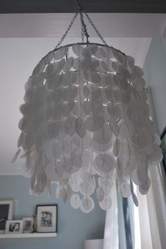 a white chandelier hanging from the ceiling