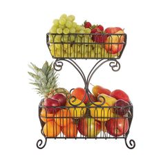 two metal baskets filled with fruit sitting on top of each other