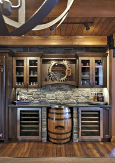 a wine barrel in the middle of a kitchen