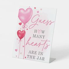 a greeting card with hearts and the words guess how many hearts are in the jar