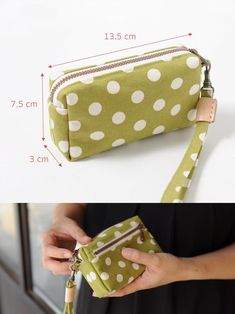 a woman holding a green polka dot purse with white dots on the front and side