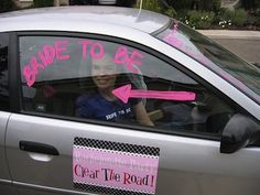 a car that has pink stickers on it