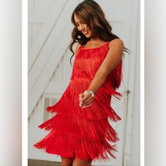 Fun Red Dress With Layered Fringe. 100% Polyester Red Fringe Party Dress, Elegant Red Dress With Fringe, Elegant Red Fringe Dresses, Red Fringed Party Dresses, Red Fringe Dress For Party, Flirty Sleeveless Holiday Dress, Red Fringe Summer Dress, Red Fringe Dresses For Summer, Sleeveless Red Dress With Fringe