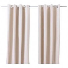 two white curtains hanging on a metal rod