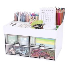 the drawers are organized with pens, pencils and markers