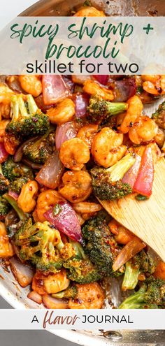 a skillet filled with shrimp and broccoli on top of a wooden spoon