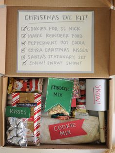 a cardboard box filled with lots of christmas treats