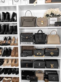 a closet filled with lots of different types of purses and handbags on shelves