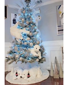 a white christmas tree with polar bears on it