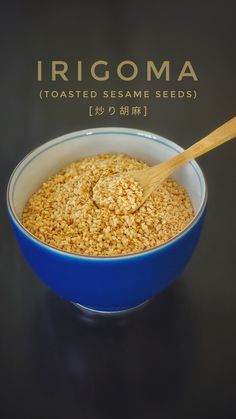 a blue bowl filled with food and a wooden spoon