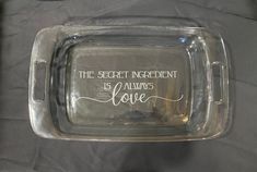 a glass tray with the words, the secret ingredient is always love