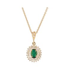 Emerald diamond pendant necklace circa 1950-1960 with a bright green GIA certified natural center emerald with a two row halo of round diamonds in a tiered design. 18k yellow gold chain. 18 inches. 1 oval green MI emerald, Approximate .35ct GIA Certificate #22011105430 39 single cut H-I VS-SI diamonds, Approximate .45ct 14k yellow gold Stamped: 14k Top to bottom: 2.9mm or 13/16 Inches Width: 10.5mm or 3/8 Inch Depth or thickness: 692mm 3.7 grams Chain: 18 Inches Width: 1.3mm Luxury Emerald Diamond Pendant Necklace, Luxury Emerald Necklace With Oval Pendant, Green Pendant Diamond Necklace For Formal Occasions, Formal Diamond Necklace For May Birthstone, Classic Green Diamond Pendant Necklace, Classic Green Pendant Diamond Necklace, Green Pendant Diamond Necklace In Classic Style, Timeless Green Necklace For Formal Occasions, Green Diamond Necklace With Halo Setting