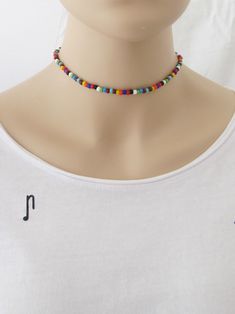 "This Multicolor Seed Bead choker is great for summer and in the beach. It is made with small seed beads. This Seed Beaded Choker can be perfect to wear everyday. This listing for one choker. Three color versions of the choker are available. Primary photo shows the choker version 2. DETAILS - Japanese glass seed beads 4 mm - Quality strong nylon string - Choker length. Choose in the drop down menu - Lobster or round clasp closure. Available gold tone (default) or silver tone (by request) - Exten Teen Necklaces, Colorful Choker, Rainbow Choker, Handmade Choker Necklace, Seed Bead Choker, Jewelry Hippie, Handmade Chokers, Necklace Colorful, Bead Choker