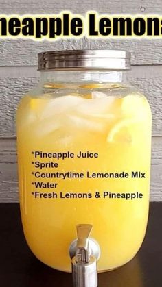 a glass jar filled with lemonade sitting on top of a table