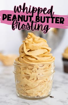 a glass jar filled with peanut butter frosting