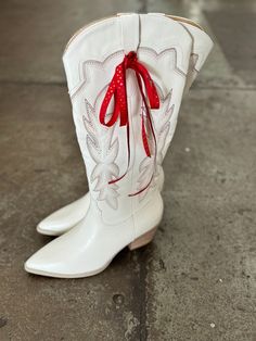 Step into style with these Well Hey Cowgirl White Cowboy Boots! The intricate cutouts and two-toned embroidery make them a standout in any crowd. Whether you're headed to a Razorback game, concert, or just want a stylish fall look, these vegan synthetic boots with padded insole and leather wrap heel will have you walking in comfort and fashion. Yeehaw!

 

Materials: Upper Material: Vegan Synthetic Upper Insole Material: Padded Insole Sole or Heel Material: Rubber Outsole, Leather Wrap Heel Details: Brand: Oasis Society Shaft Height: 14.5" Heel Height: 2.5" The Front Platform: Types of Closures: Zipper Circumference of Shoe Opening: 15" Shaft Circumference: 13" Whitecowgirl Boots, Game Day Cowboy Boots, Knee High White Cowgirl Boots, White Cowboy Boots Fringe, Whute Cowgirl Boots, White Weatern Boots, Razorback Shirt, Custom Cowboy Boots, White Cowboy Boots