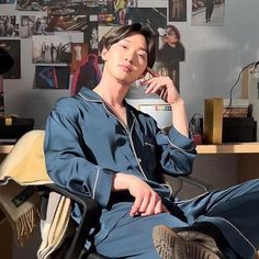 a young man sitting in an office chair