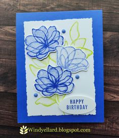 a birthday card with blue flowers on it