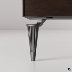 a close up of a desk with a drawer on one side and a metal base on the other