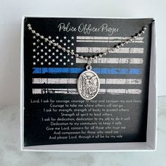 a necklace with an american flag and the words police officer prayer on it