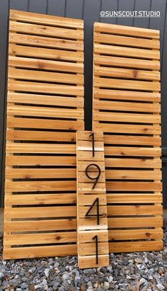 two wooden slats with numbers on them