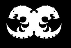 two black and white masks with faces in the shape of hearts on a black background