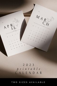 two calendars sitting on top of a table next to each other with the word october written on them