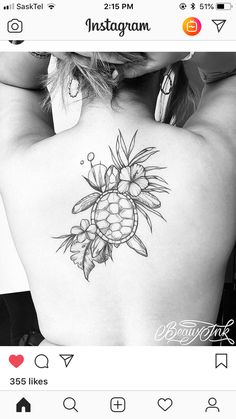 a woman's back with a pineapple tattoo on it