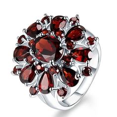 an image of a ring with red stones