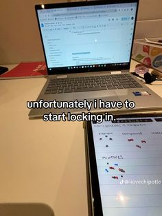 an open laptop computer sitting on top of a white desk next to a mouse and keyboard