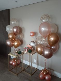 a room filled with lots of balloons on the wall